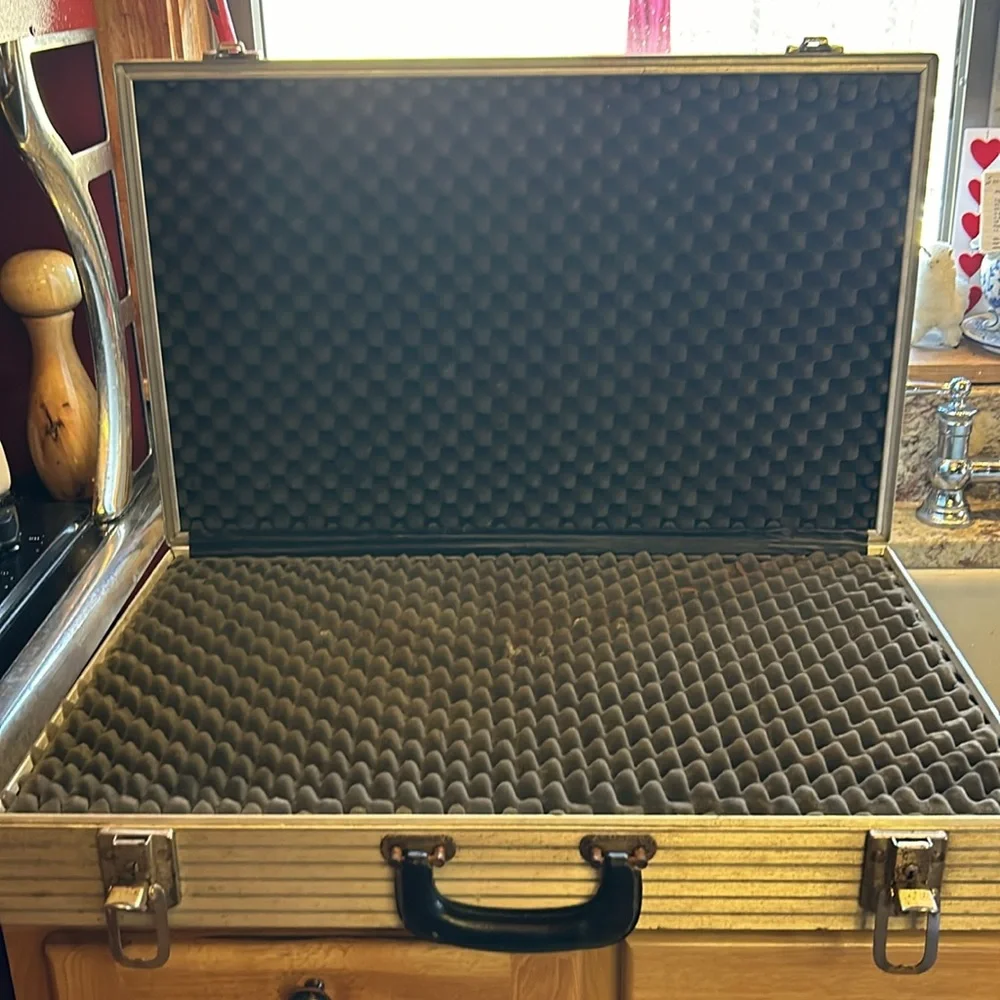 Aluminum padded case, handy for carrying anything; 24”long, 13.5”wide 4” deep